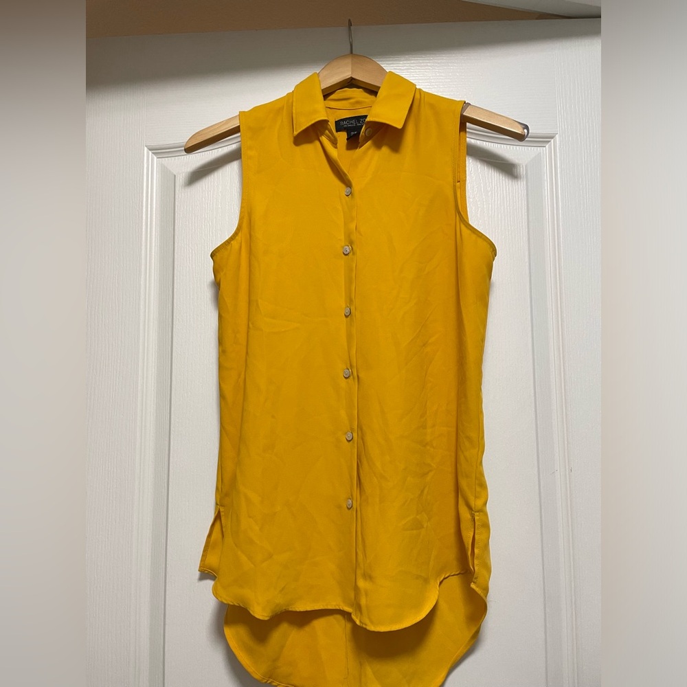 Yellow sleeveless button down blouse